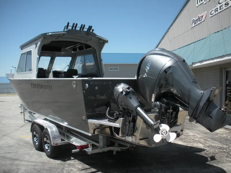 Slide: The Image of 2025 Duckworth 24 Pacific Pro boat on trailer, featuring powerful outboard motor. - 26
