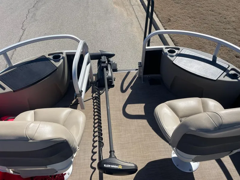 Slide: The Image of 2022 Sun Tracker BB18 boat interior with seating and trolling motor. - 5