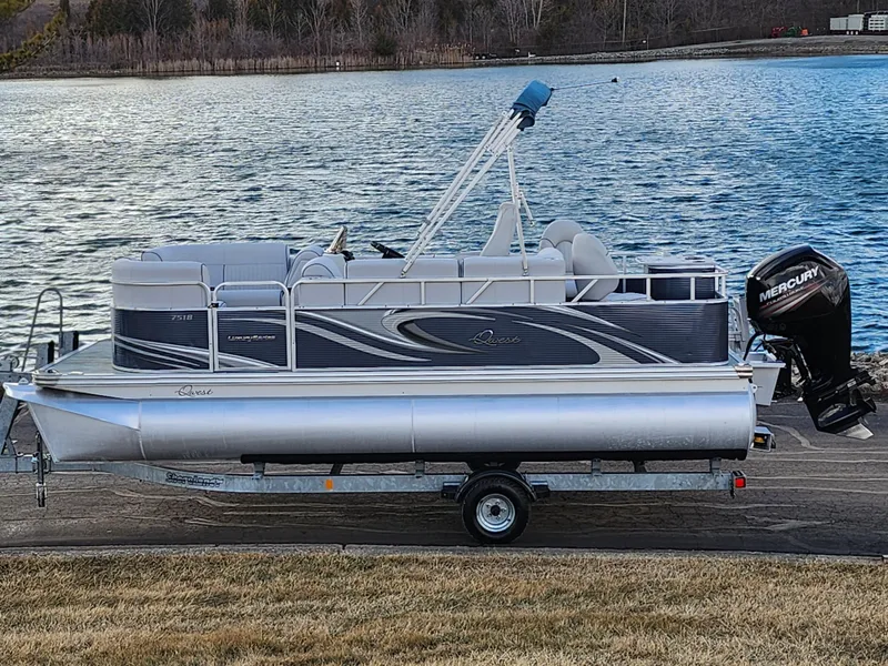 Slide: The Image of 2018 Qwest LS 7518 Cruise FTL pontoon boat on trailer by a lake. - 0