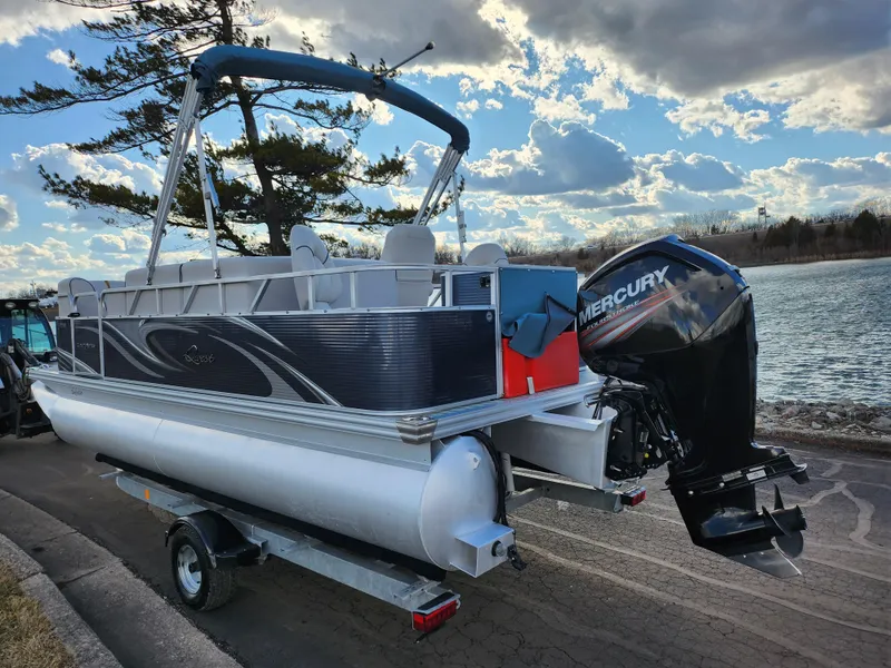 Slide: The Image of 2018 Qwest LS 7518 Cruise FTL pontoon boat with Mercury outboard motor on trailer. - 1