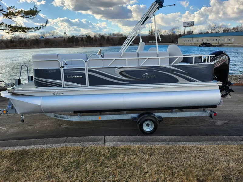 Slide: The Image of 2018 Qwest LS 7518 Cruise FTL pontoon boat on trailer by a lake. - 10