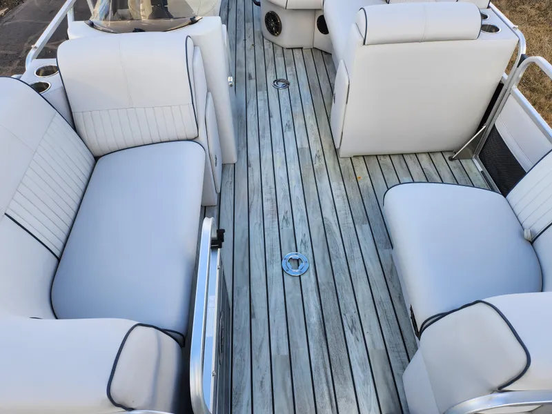 Slide: The Image of 2018 Qwest LS 7518 Cruise FTL boat interior with white seating and wooden flooring. - 11