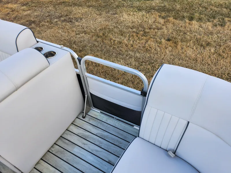 Slide: The Image of 2018 Qwest LS 7518 Cruise FTL boat interior with white seating and wooden flooring. - 13