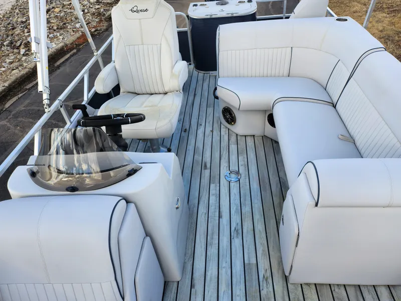 Slide: The Image of 2018 Qwest LS 7518 Cruise FTL boat interior with white seating and wooden deck. - 14