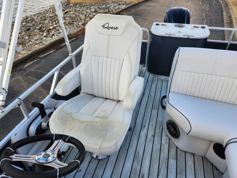 Slide: The Image of 2018 Qwest LS 7518 Cruise FTL boat interior with white seating and steering wheel. - 15