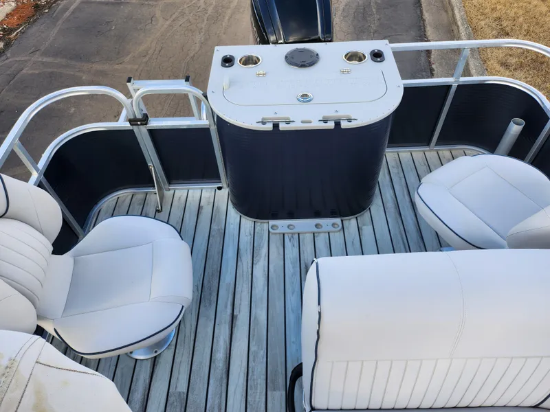 Slide: The Image of 2018 Qwest LS 7518 Cruise FTL boat interior with white seating and control panel. - 16