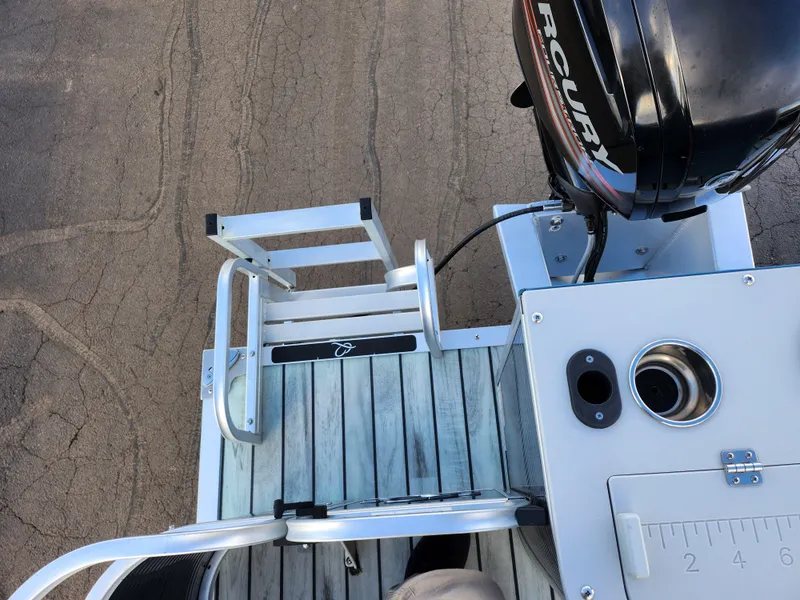 Slide: The Image of 2018 Qwest LS 7518 Cruise FTL boat with Mercury engine and swim ladder. - 18