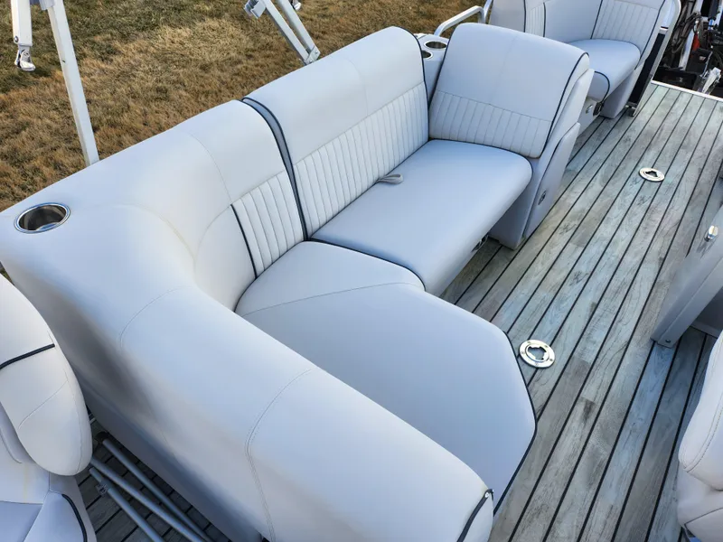 Slide: The Image of 2018 Qwest LS 7518 Cruise FTL boat interior with gray seating and wooden deck. - 21