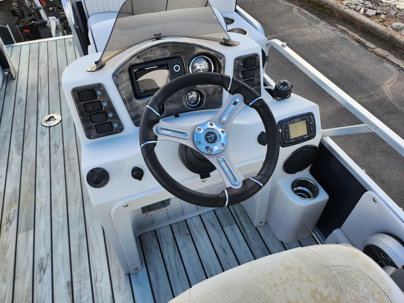 Slide: The Image of Steering console of 2018 Qwest LS 7518 Cruise FTL boat with modern controls and dashboard. - 22