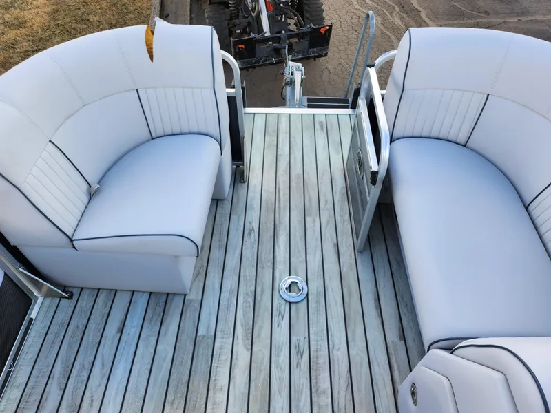 Slide: The Image of 2018 Qwest LS 7518 Cruise FTL boat with white seating and wooden deck. - 24