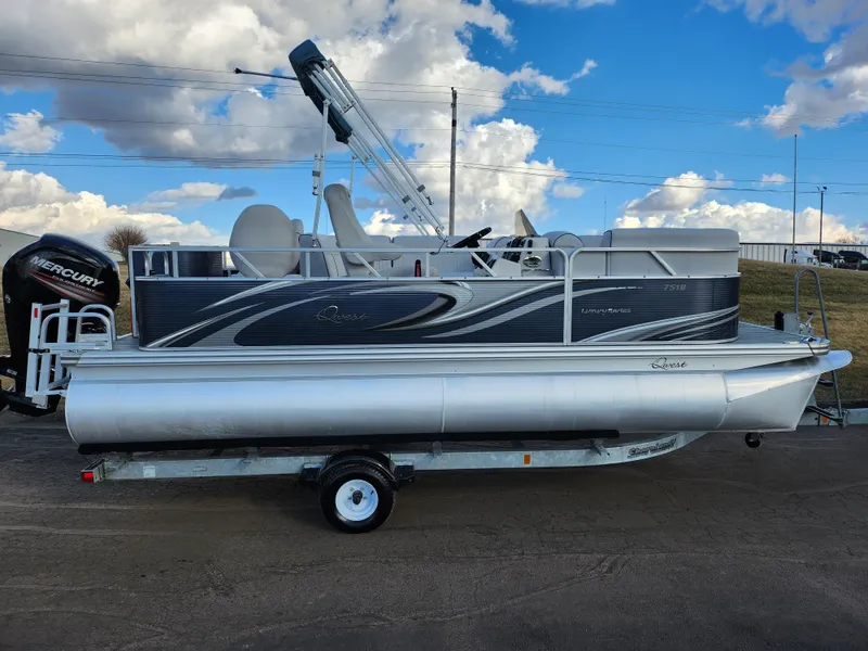 Slide: The Image of 2018 Qwest LS 7518 Cruise FTL pontoon boat on trailer, under cloudy sky. - 4