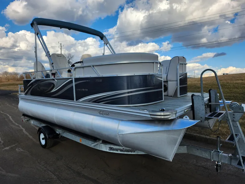 Slide: The Image of 2018 Qwest LS 7518 Cruise FTL pontoon boat on trailer, under a partly cloudy sky. - 5