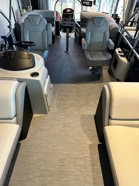 Slide: The Image of 2023 Lowe SF212 Walk-Through boat interior with modern seating and steering console. - 3
