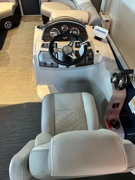 Slide: The Image of 2023 Lowe SF212 Walk-Through boat interior with steering console and seating. - 5