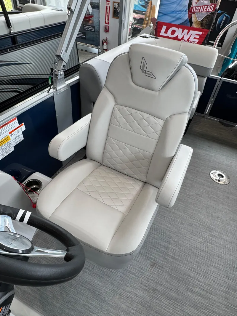 Slide: The Image of Captain's chair in 2023 Lowe SS212 Walk-Through boat, featuring elegant design and comfortable seating. - 8