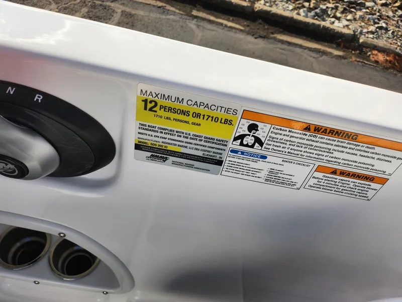 Slide: The Image of 2019 Hurricane SunDeck Sport 202 IO capacity label, maximum 12 persons or 1710 lbs. - 12