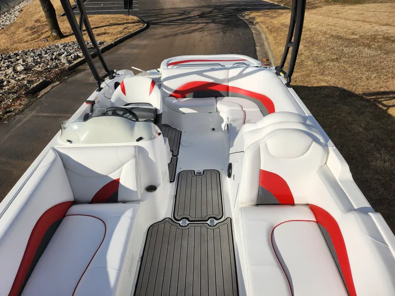 Slide: The Image of 2019 Hurricane SunDeck Sport 202 IO boat interior with red and white seating. - 20