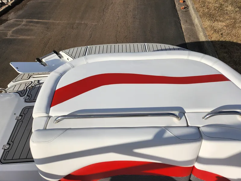Slide: The Image of 2019 Hurricane SunDeck Sport 202 IO boat with red and white seating. - 23