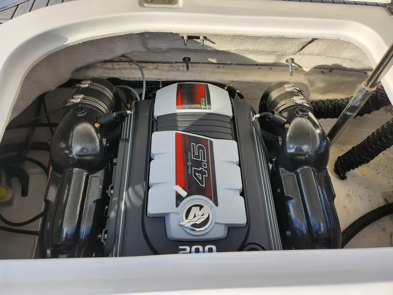 Slide: The Image of 2019 Hurricane SunDeck Sport 201 IO engine compartment with 4.5L 200 HP engine. - 25