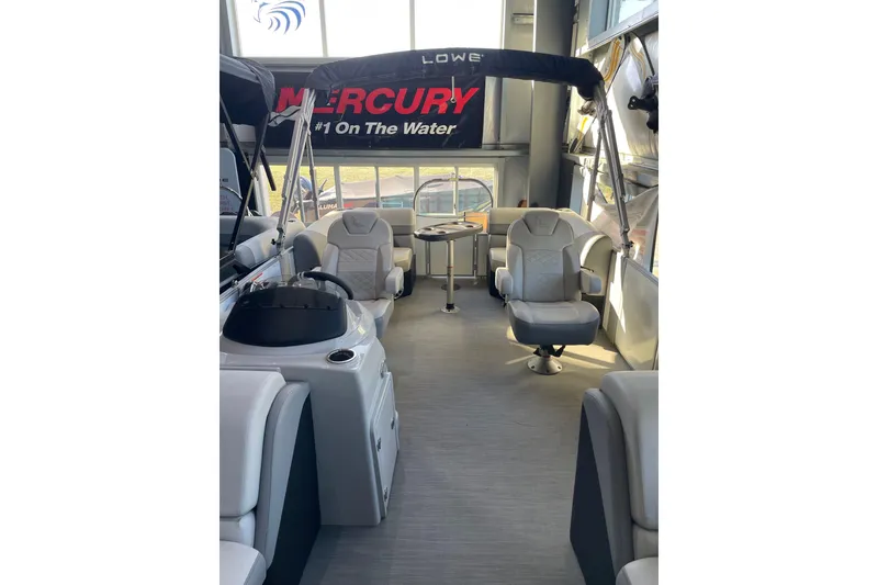 Slide: The Image of 2023 Lowe SS 210 WT pontoon boat interior with seating and helm. - 2