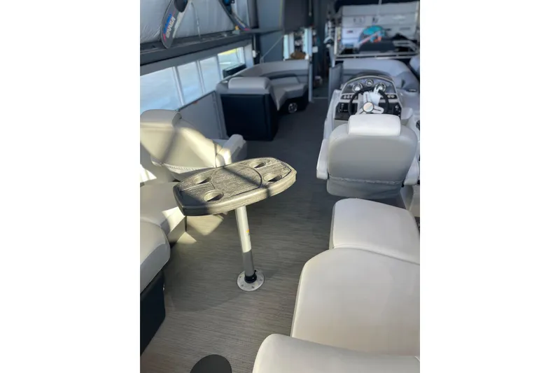 Slide: The Image of 2023 Lowe SS 210 WT boat interior with seating and steering console. - 3