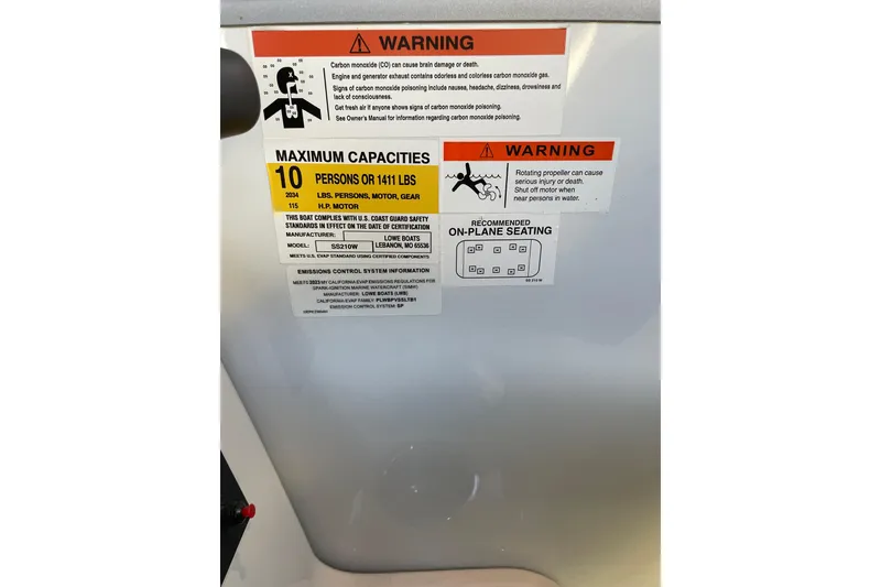 Slide: The Image of Warning label on 2023 Lowe SS 210 WT boat, detailing maximum capacities and safety instructions. - 6