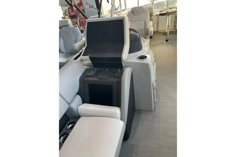 Slide: The Image of 2023 Lowe SS 210 WT boat interior with open storage compartment and seating. - 7