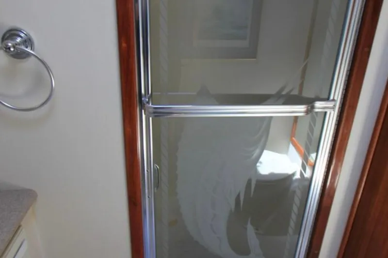 Slide: The Image of Shower door with etched design in 1997 Mediterranean 54 Convertible yacht bathroom. - 13