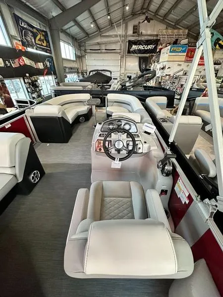 Slide: The Image of 2023 Lowe SS 230 CL pontoon boat with red exterior and black cover. - 2