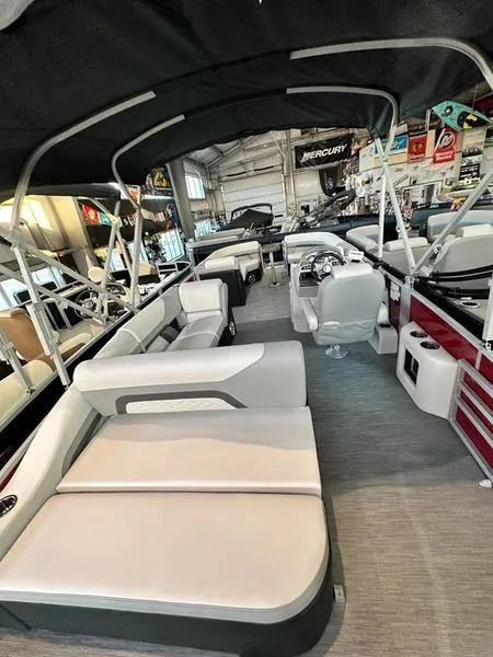 Slide: The Image of 2023 Lowe SS23CL pontoon boat interior with plush seating and modern design. - 5