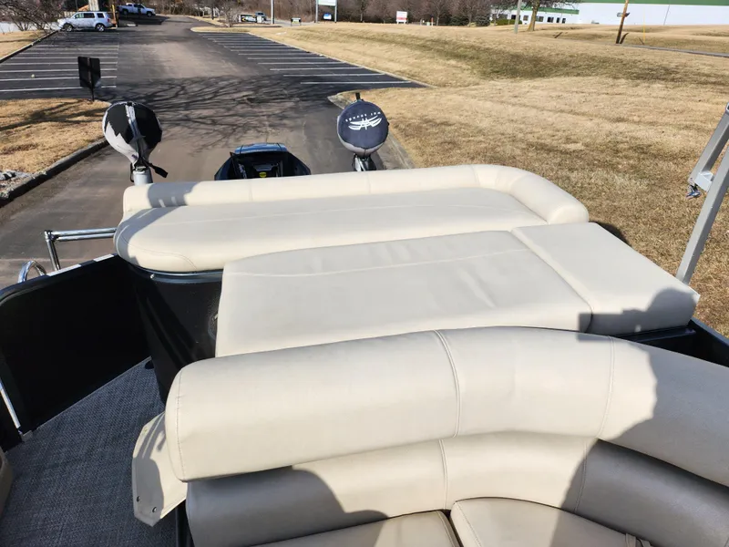 Slide: The Image of 2019 Premier 250 Grand Majestic RE boat with beige seating, parked outdoors. - 17