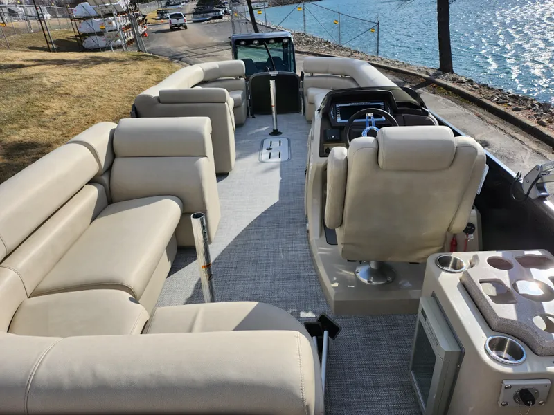 Slide: The Image of 2019 Premier 250 Grand Majestic RE pontoon boat with spacious seating and modern interior. - 24