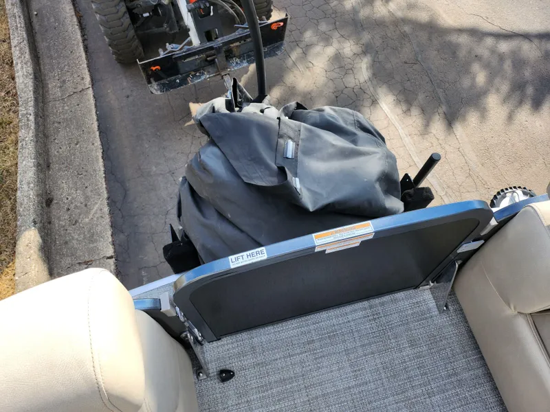 Slide: The Image of 2019 Premier 250 Grand Majestic RE boat interior with covered engine and seating. - 29