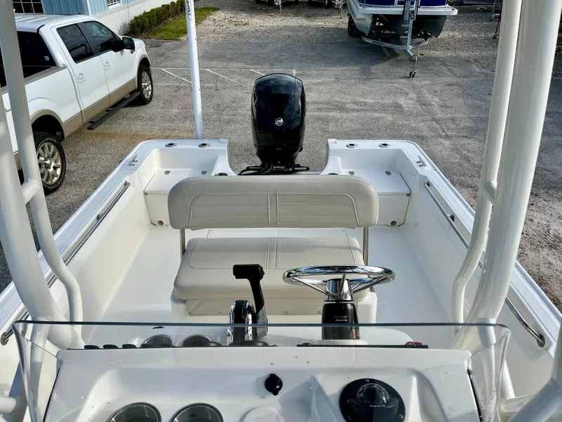 Slide: The Image of 2023 Boston Whaler 190 Montauk boat interior with steering console and seating. - 14