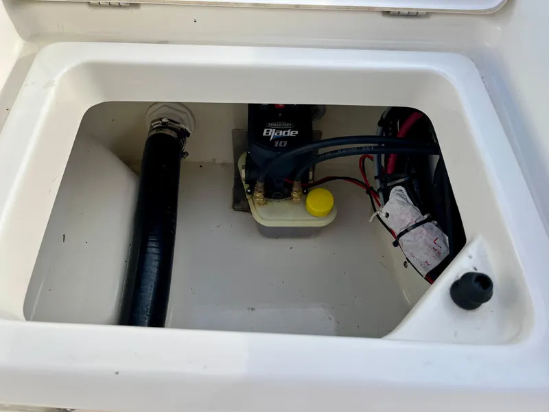 Slide: The Image of 2023 Boston Whaler 190 Montauk boat compartment with wiring and components. - 19