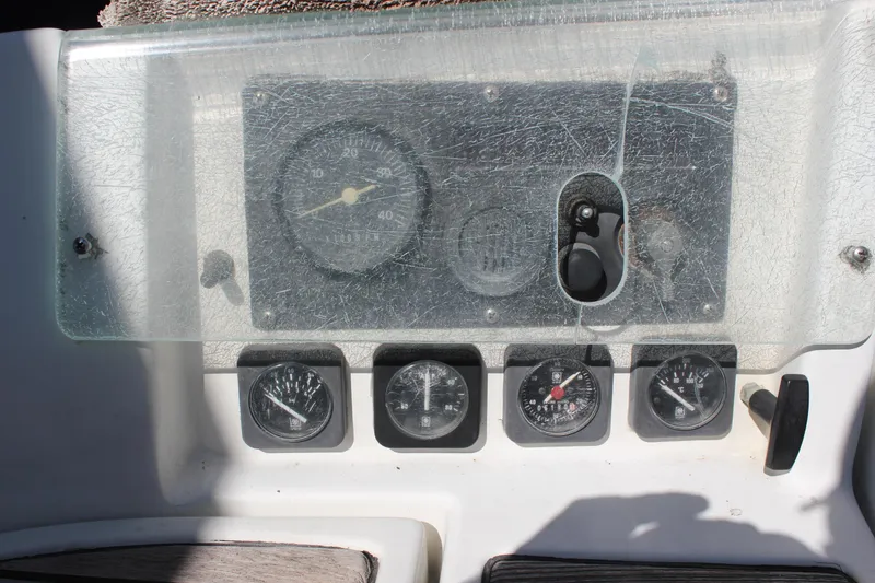 Slide: The Image of Dashboard of a 1997 Beneteau Oceanis 461 sailboat with various gauges and controls. - 10