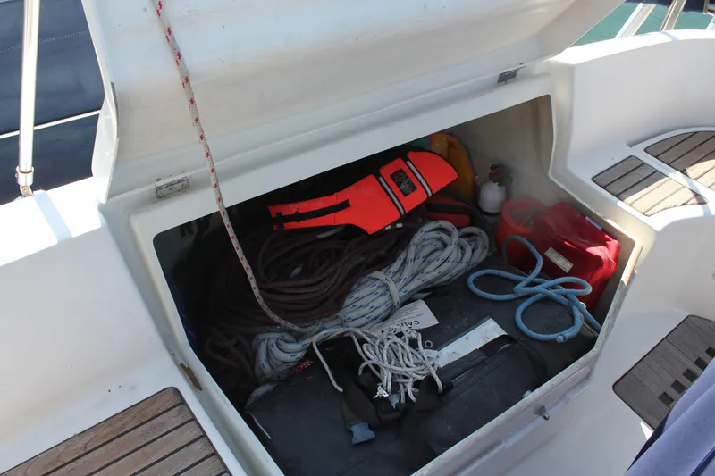 Slide: The Image of Storage compartment on a 1997 Beneteau Oceanis 461 sailboat with ropes and safety gear. - 45