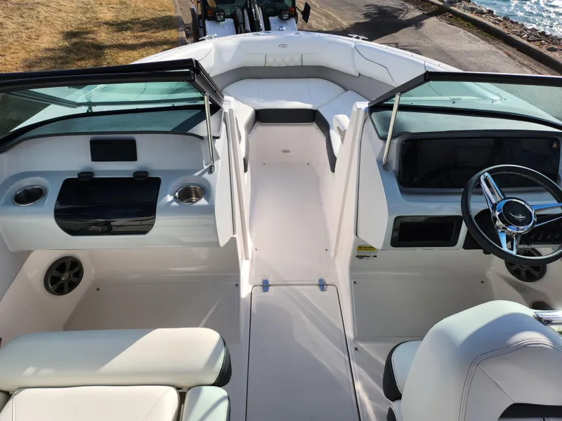 Slide: The Image of 2021 Regal LS2 boat interior with white seating and modern dashboard design. - 13