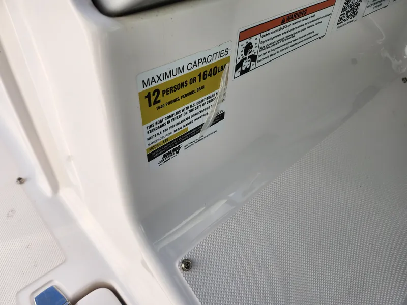 Slide: The Image of 2021 Regal LS2 boat capacity label, maximum 12 persons or 1640 lbs. - 18