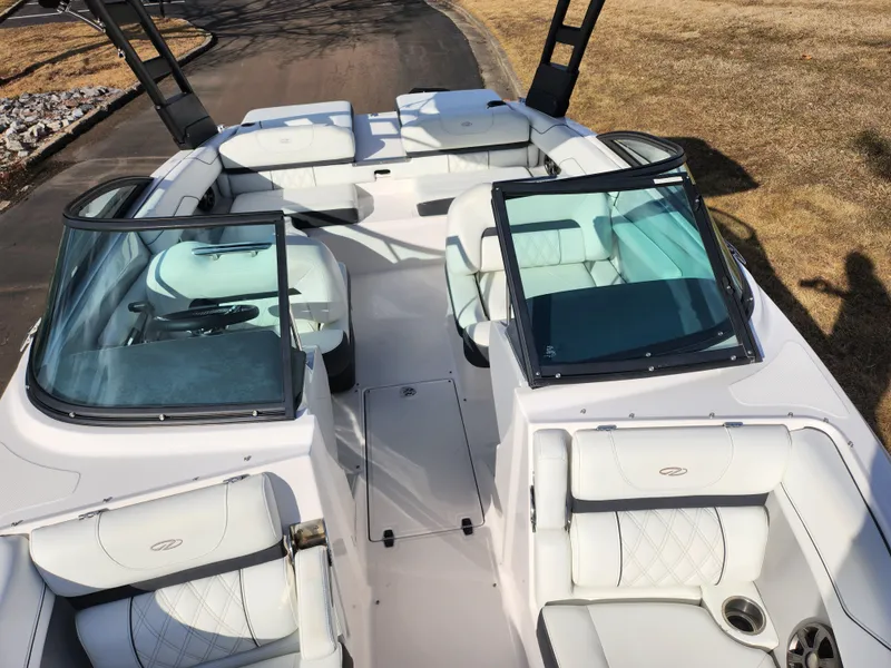 Slide: The Image of 2021 Regal LS2 boat interior with white seating and open windshield. - 23