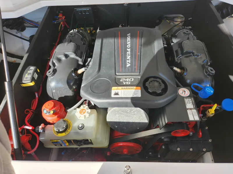 Slide: The Image of 2021 Regal LS2 engine compartment featuring a Volvo Penta 240 V6 engine. - 28