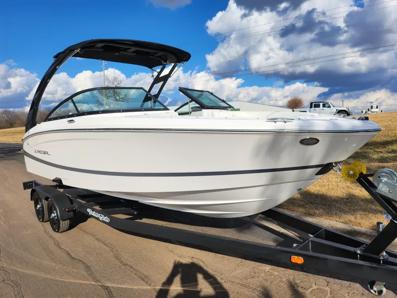 Slide: The Image of 2021 Regal LS2 boat on trailer under blue sky with clouds. - 5