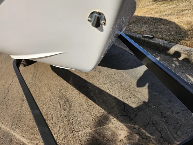 Slide: The Image of 2021 Regal LS2 boat on trailer, close-up view of hull and trailer frame. - 7