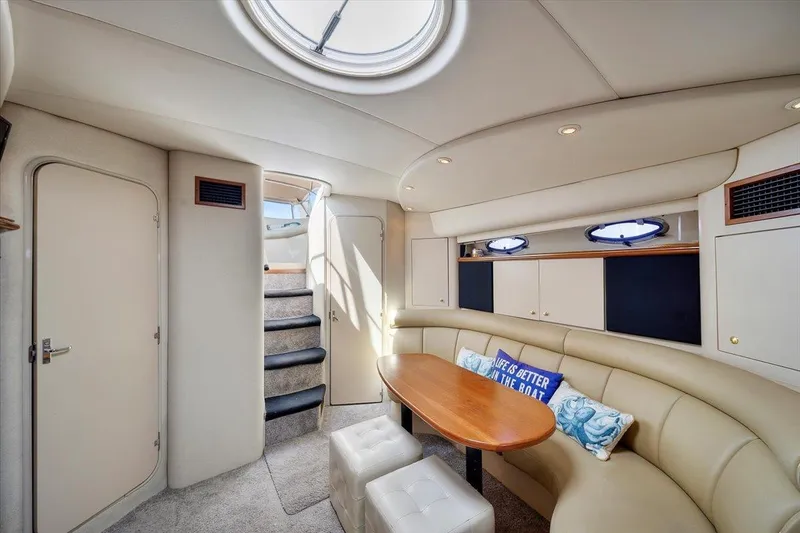 Slide: The Image of Interior of 1999 Cruisers Yachts 3870 Esprit with seating, table, and stairs. - 20