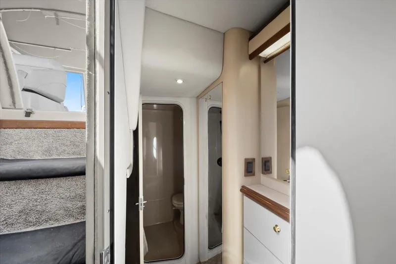 Slide: The Image of 1999 Cruisers Yachts 3870 Esprit interior with bathroom and stairs. - 23