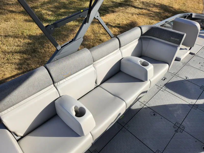 Slide: The Image of 2022 Sea-Doo Switch Cruise 21 interior with comfortable seating and cup holders. - 16
