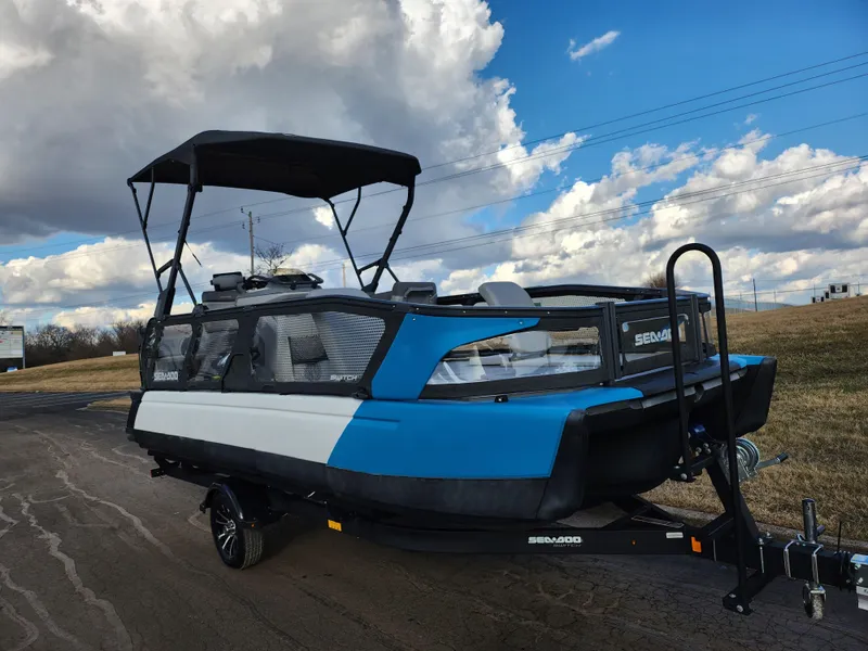 Slide: The Image of 2022 Sea-Doo Switch Cruise 21 boat on trailer under cloudy sky. - 5