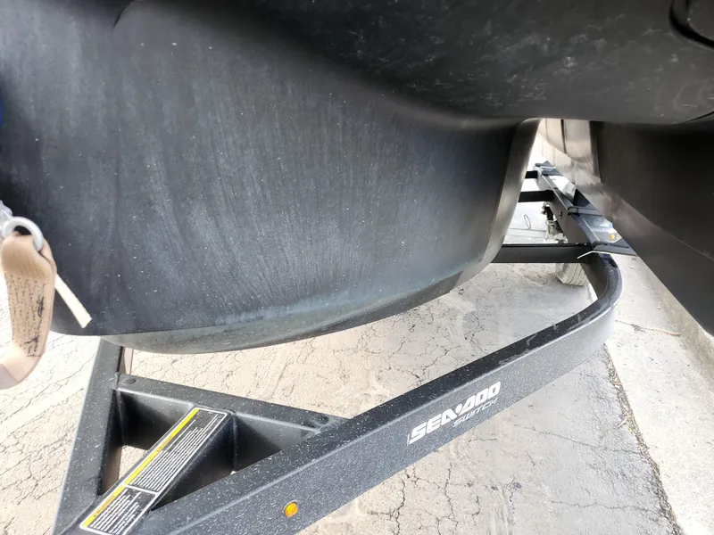 Slide: The Image of 2022 Sea-Doo Switch Cruise 21 on trailer, close-up view of hull and frame. - 7