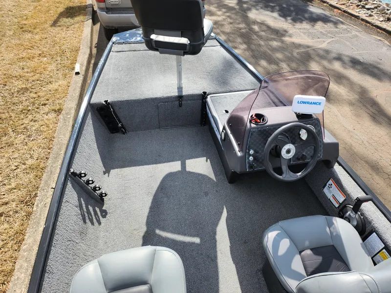 Slide: The Image of 2021 Tracker Bass Tracker Classic XL boat interior with steering console and seating. - 10