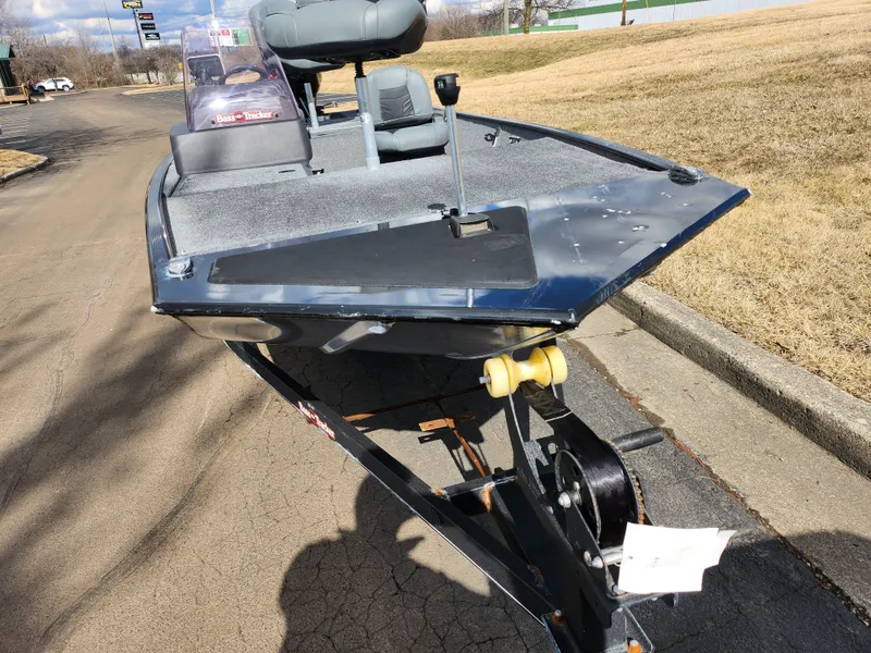 Slide: The Image of 2021 Tracker Bass Tracker Classic XL boat on trailer, parked on a paved road. - 6
